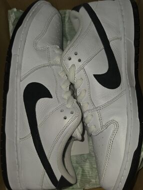Nike White Sneakers with Black Swoosh